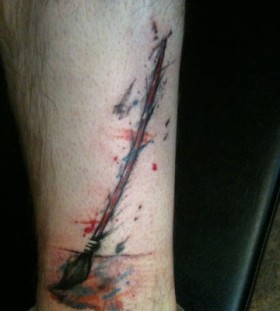 Paint brush leg tattoo