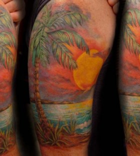 Palm tree and sunset tattoo