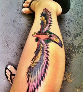 Parrot with long wings leg tattoo