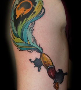 Peacock feather pen tattoo