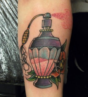 Perfume bottle and flower tattoo