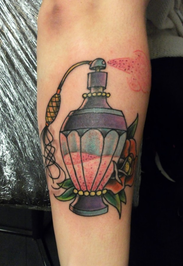 Perfume bottle and flower tattoo