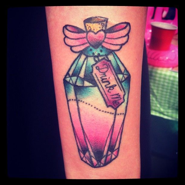 Pink heart and bottle tattoo