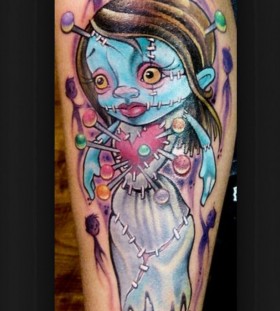 Pinned doll arm tattoo