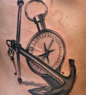 Pocket watch and anchor tattoo