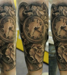 Pocket watch and flowers tattoo