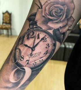 Pocket watch and rose tattoo by Xavier Garcia Boix