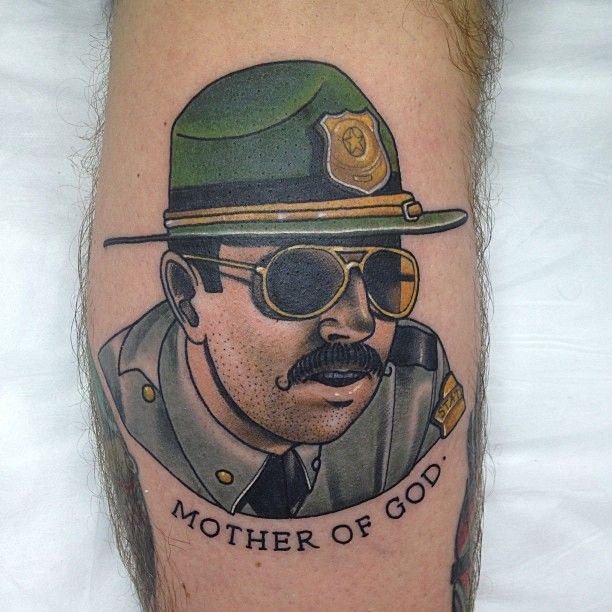 Police officer tattoo by Dan Molloy