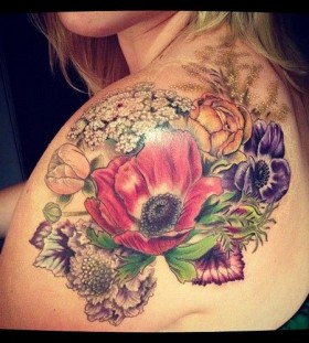 Pretty flowers tattoo by Esther Garcia