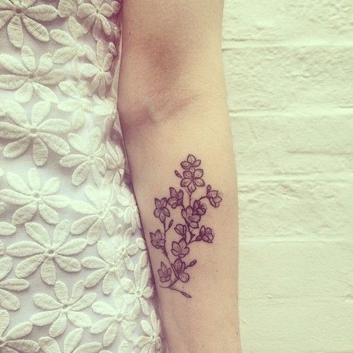 Pretty flowers tattoo by Rebecca Vincent