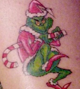 Pretty green grinch christmas tattoo