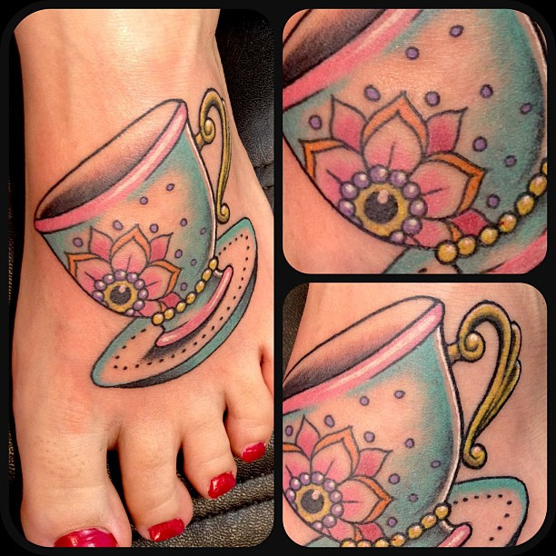 Pretty teacup foot tattoo