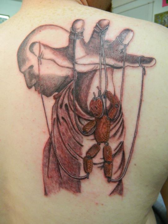 Puppet master and puppet tattoo