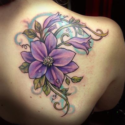 Purple flower back tattoo by Jessica Brennan