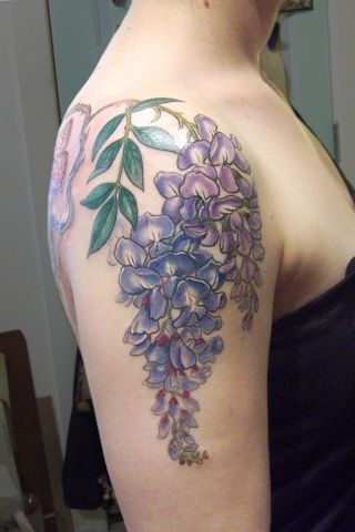 Purple flowers tattoo by Esther Garcia