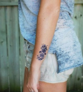 Purple flowers wrist tattoo