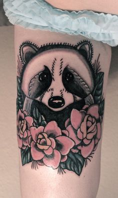 Raccoon and flowers tattoo