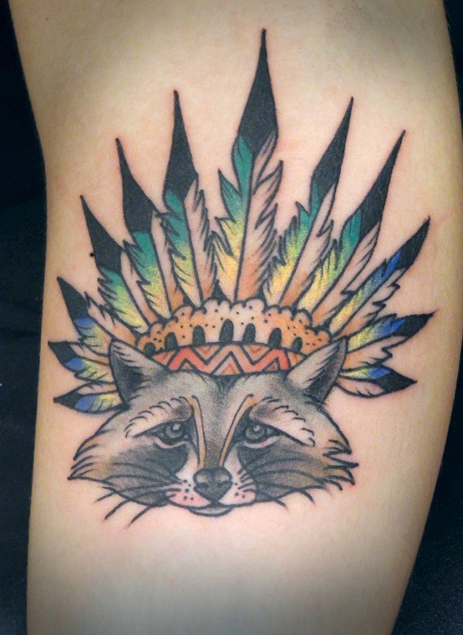 Raccoon wearing a feather hat tattoo