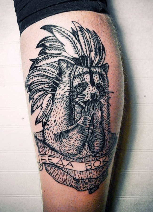 Raccoon with feather hat tattoo