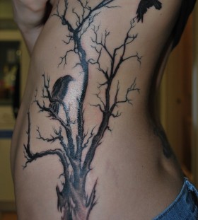 Raven and tree side tattoo