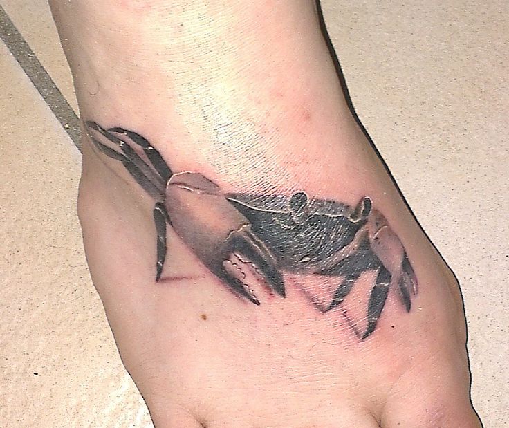 Realistic crab foot tattoo
