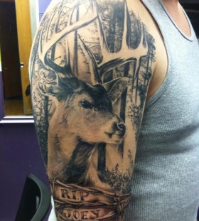Realistic deer and trees tattoo