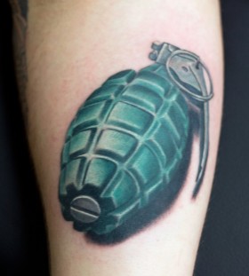 Realistic grenade arm tattoo