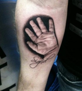 Realistic hand tattoo by Ellen Westholm