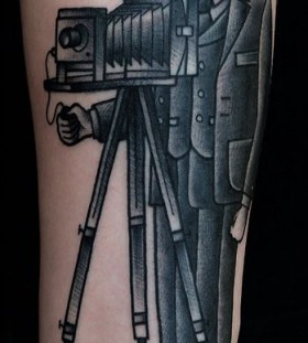 Realistic photographer tattoo by Philip Yarnell