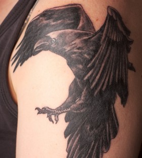 Realistic raven arm tattoo