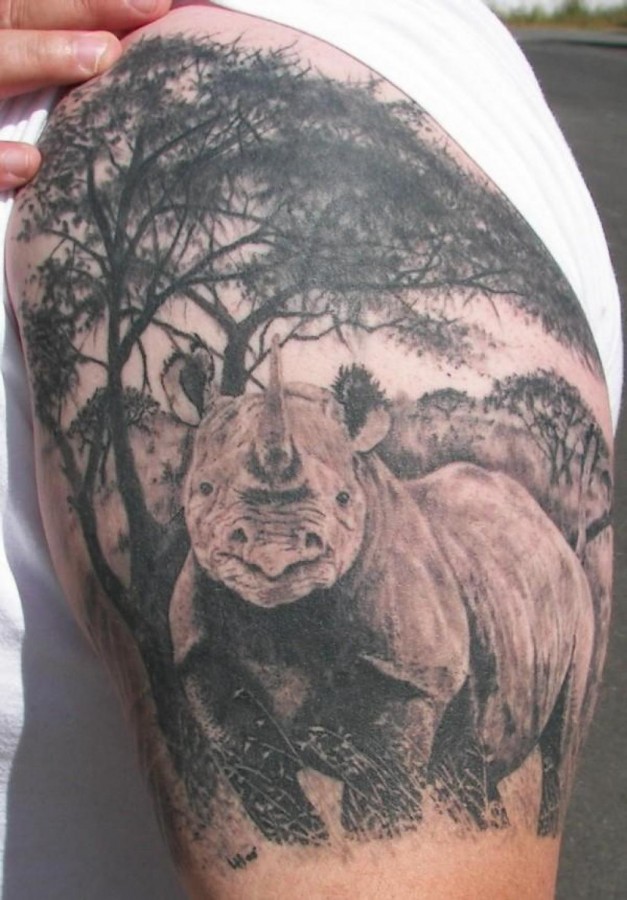 Realistic rhino arm tattoo