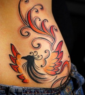 Red and black tribal bird tattoo