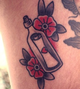 Red flowers and bottle tattoo