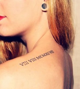 Red girl's lips and shoulder Roman numeral tattoo