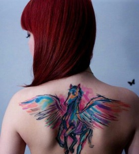 Red hair girl's unicorn tattoo