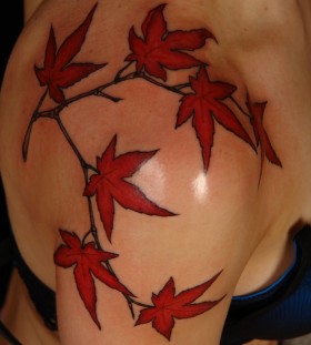 Red maple leaves shoulder tattoo