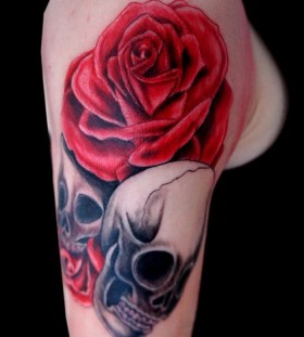 Red rose and skull tattoo