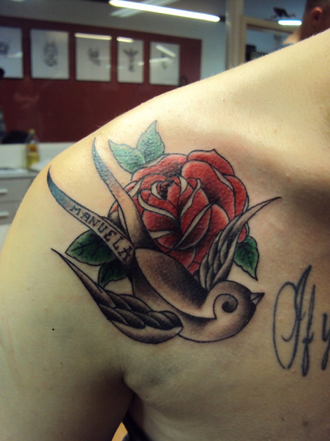 Red rose and swallow tattoo