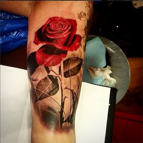 Red rose leg tattoo by Ellen Westholm
