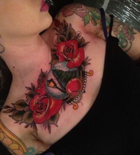 Red roses chest tattoo by Dan Molloy