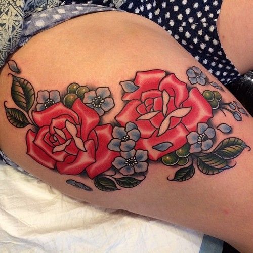 Red roses leg tattoo by Clare Hampshire