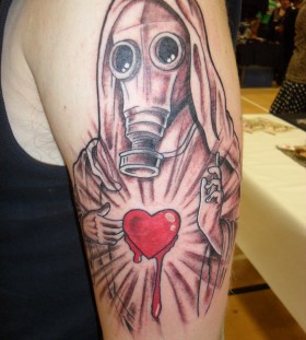 Religious gas mask and heart tattoo