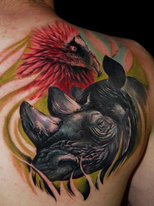 Rhino and bird back tattoo
