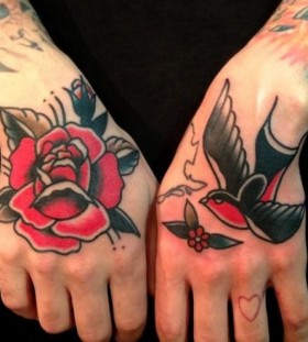 Rose and sparrow hand tattoos by Nick Oaks