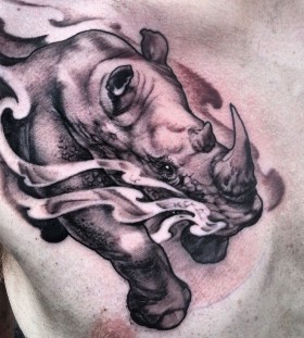 Running rhino chest tattoo