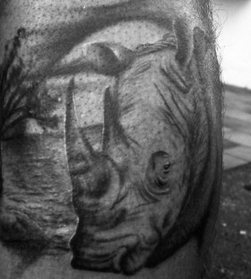Sad rhino leg tattoo
