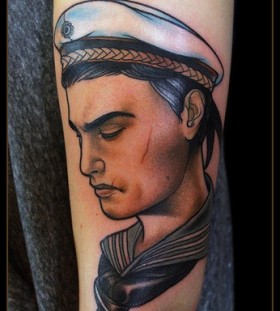 Sad sailor arm tattoo