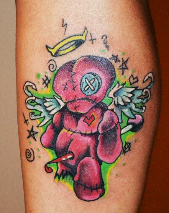 Sad voodoo doll tattoo