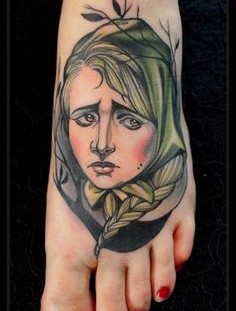 Sad woman foot tattoo