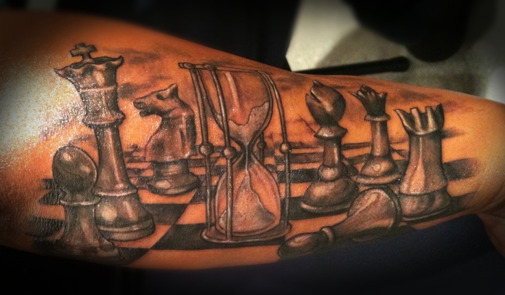 Sand clock and chess tattoo